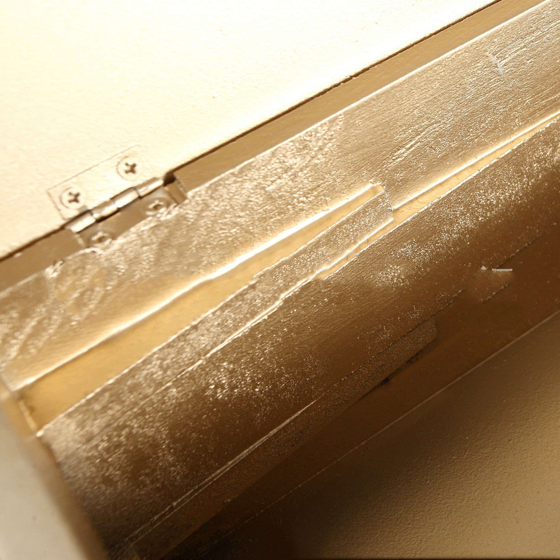 Interior corner detail of the gold-tone lined book style tissue box cover